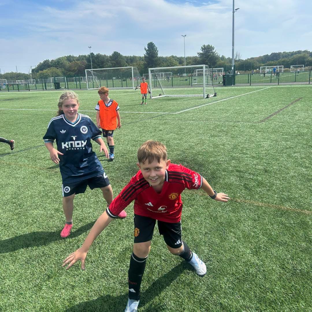 Young footballers enjoying a coaching session