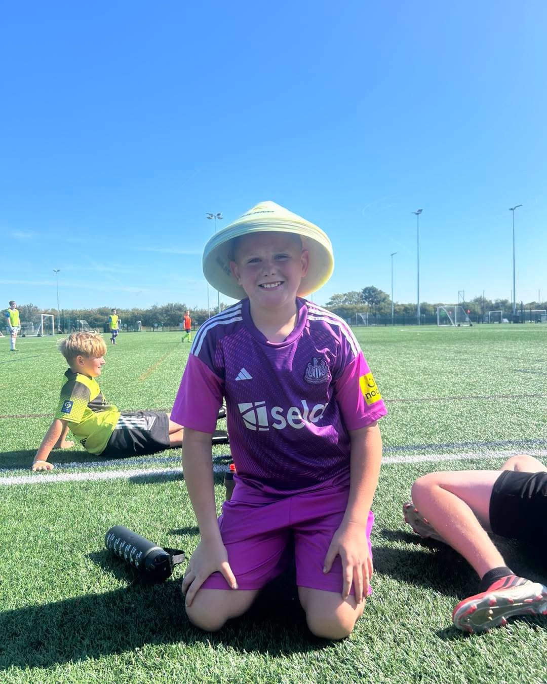 Football camp friends on the pitch
